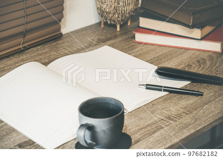 Desk, cup and writing utensil 97682182