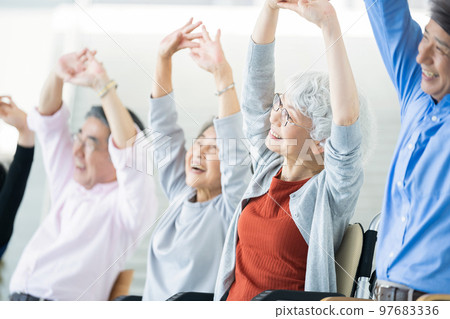 Elderly housing with care users doing gymnastics Senior image Caregiver 97683336