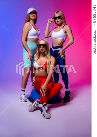 Stylish women in underwear and sunglasses in studio 97683343