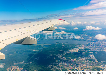 View from the airplane window during taking off on a clear summer morning. Yekaterinburg, Russia View from the airplane window during taking off on a clear summer morning. Yekaterinburg, Russia 97684671