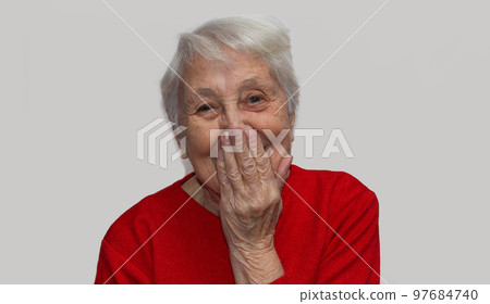 Portrait of happy senior woman laughing isolated on white studio background. Human emotions concept. emotional old lady standing indoor Portrait of happy senior woman laughing isolated on white studio background. Human emotions concept. emotional old lady standing indoor 97684740