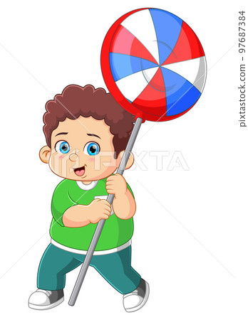 A cute boy holding a big lollipop candy of illustration 97687384