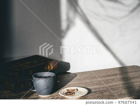 Light and cup by the window Light and cup by the window 97687541