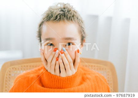 Belly short woman wearing orange knit 97687919