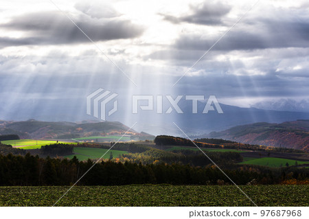Biei, Hokkaido, morning light coming through the clouds, Japan 97687968