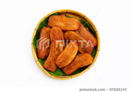 Sun dried bananas on white background. 97688245