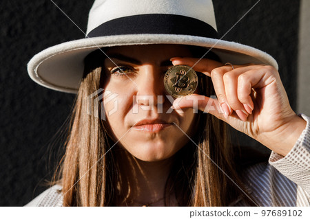 Beautiful girl in glasses from bitcoin. Bitcoin cryptocurrency. Sexy woman with bitcoin isolated on outdoor. Bull market. Beautiful girl in glasses from bitcoin. Bitcoin cryptocurrency. Sexy woman with bitcoin isolated on outdoor. Bull market. 97689102