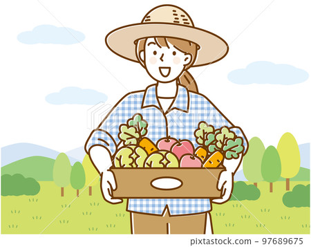 Young woman wearing a straw hat and holding a box of vegetables 97689675