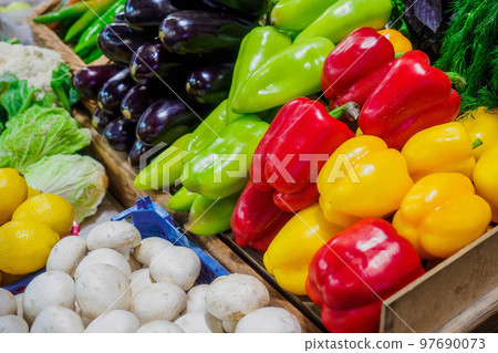Fresh vegetables are in tray at grocery market. Beautiful layout of colorful and juicy vegetables 97690073