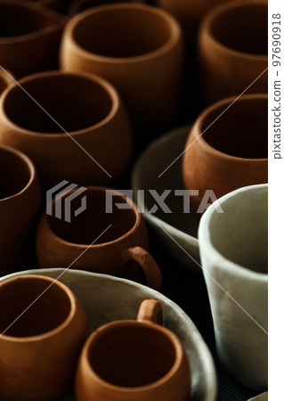 Handmade ceramic cups top view. Designer ceramic plates, bowls, cups and jugs 97690918