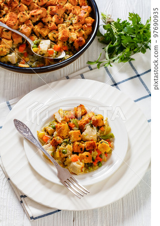 turkey pot pie with stuffing crust on plate turkey pot pie with stuffing crust on plate 97690935