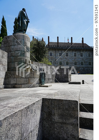 Statue of king and castle in Guimaraes, Portugal - vertical 97691343