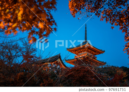 japanese pagoda stand against in autumn season japanese pagoda stand against in autumn season 97691731