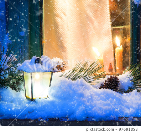 Glowing lantern on the windowsill Glowing lantern on the windowsill 97691858