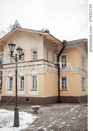 An old mansion with a wooden veranda, built in the 19th century 97692739