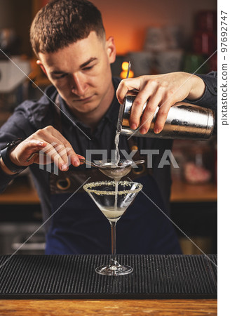 Man bartender at work Man bartender at work 97692747