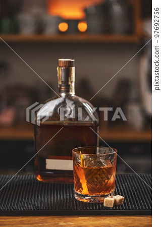 Old fashioned cocktail on table 97692756