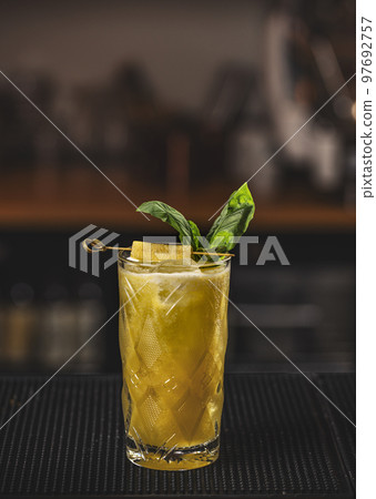 Glass with cold fresh pineapple smoothie 97692757