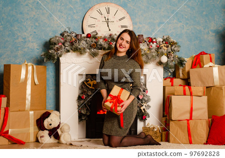 Modern woman's beauty, cute girl with pretty face, fashionable plus size figure, Christmas background 97692828
