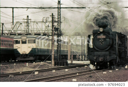 1970 Steam locomotive and train running side by side Yokohama Tsurumi Tokaido Line Takashima Freight Line 97694023