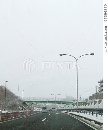 Snow-covered road  97694879