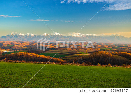 Biei Hill Tokachidake mountain range in late autumn Biei Hill Tokachidake mountain range in late autumn 97695127