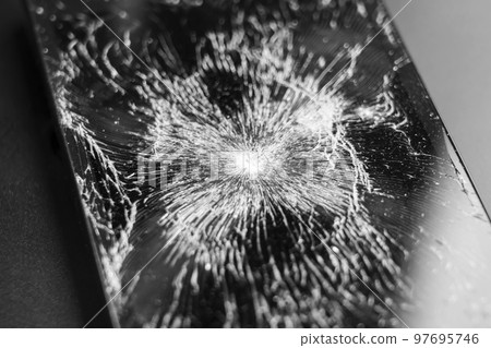 Broken cracked mobile phone touchscreen closeup Broken cracked mobile phone touchscreen closeup 97695746