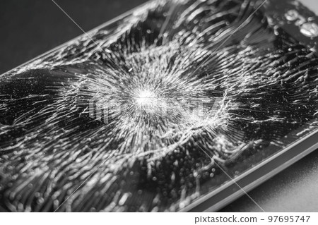 Smashed crushed smartphone with broken cracked display close up Smashed crushed smartphone with broken cracked display close up 97695747