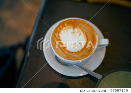 Cafe latte with latte art written 97697139