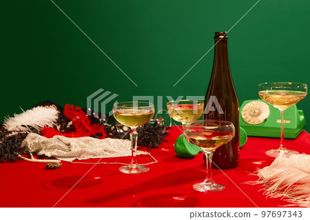 Christmas party aesthetics. Table with red tablecloths served with champagne. New year celebration 97697343