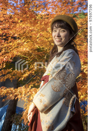 autumn leaves and kimono woman 97697596
