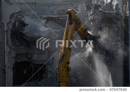 Building demolition: A large-scale splitter crushing pillars 97697690