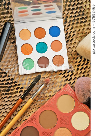 fashion set of new cosmetics palettes with  brushes. close up 97698469