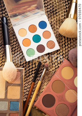 fashion set of new cosmetics palettes with  brushes. close up 97698470