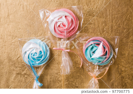 A vegetarian aquafaba meringue candy on a stick 97700775