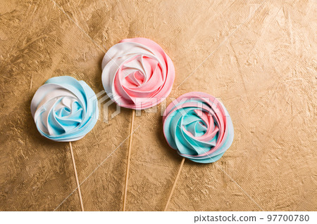 A three vegetarian aquafaba meringue candy on a stick A three vegetarian aquafaba meringue candy on a stick 97700780