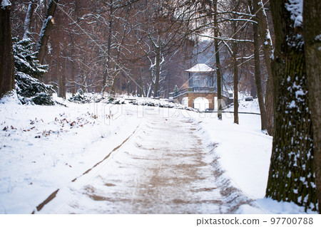 Winter view of the road to the Chinese bridge in Oleksandria Park, Ukraine Winter view of the road to the Chinese bridge in Oleksandria Park, Ukraine 97700788