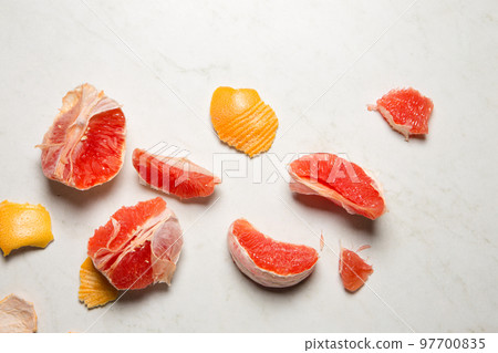 juicy grapefruit and peel on a light background 97700835