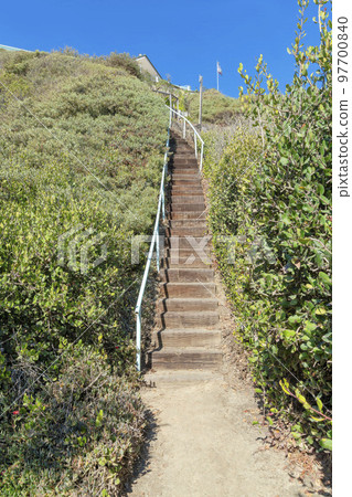 Wooden stairs with handrailing on a hill at San Clemente, California Wooden stairs with handrailing on a hill at San Clemente, California 97700840