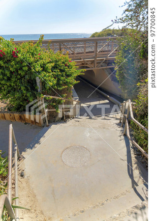 Concrete stairs leading to an underpass at San Clemente, California 97700845