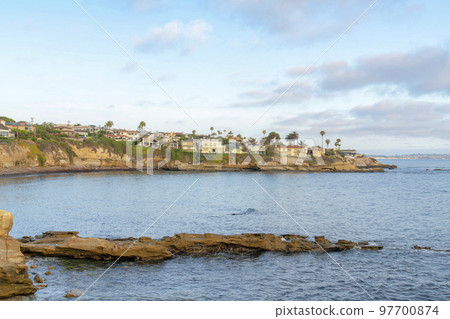 La Jolla rocky coastal lines with beach front homes in California 97700874