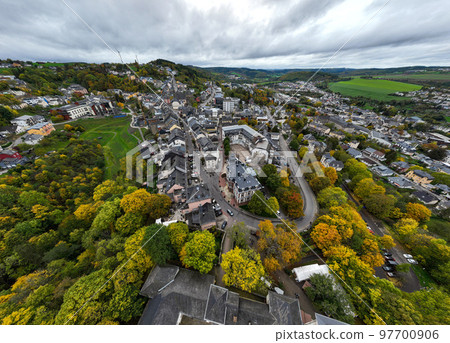 Aerial Drone Shot in Wiltz Luxembourg. View on a Castle at cloudy autumn day in Wiltz Aerial Drone Shot in Wiltz Luxembourg. View on a Castle at cloudy autumn day in Wiltz 97700906