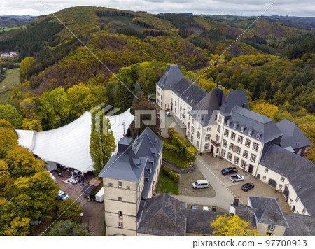Aerial Drone Shot in Wiltz Luxembourg. View on a Castle at cloudy autumn day in Wiltz 97700913