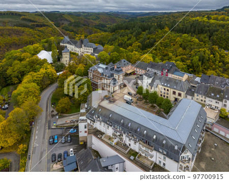 Aerial Drone Shot in Wiltz Luxembourg. View on a Castle at cloudy autumn day in Wiltz Aerial Drone Shot in Wiltz Luxembourg. View on a Castle at cloudy autumn day in Wiltz 97700915