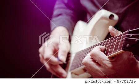 close up musician hands playing white electric guitar. music background close up musician hands playing white electric guitar. music background 97701729