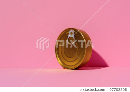 Canned food tin on pink studio background 97702208