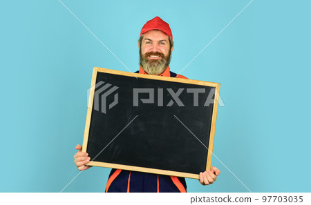 Architect Worker hold blackboard. Conference Meeting. person presenting at chalkboard. Businessman. male construction worker. man with presentation. Builder points to board. copy space Architect Worker hold blackboard. Conference Meeting. person presenting at chalkboard. Businessman. male construction worker. man with presentation. Builder points to board. copy space 97703035
