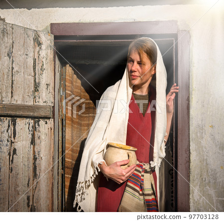 Girl with a pot in ancient clothes Girl with a pot in ancient clothes 97703128