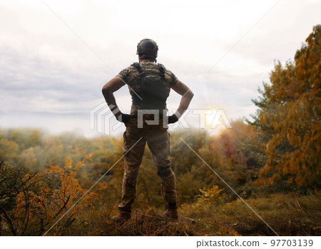 Sad soldier look to the sky 97703139