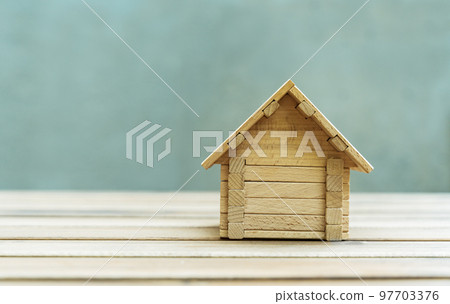 Toy wooden house. Own house, own home, house building and renovation concept. Toy wooden house. Own house, own home, house building and renovation concept. 97703376